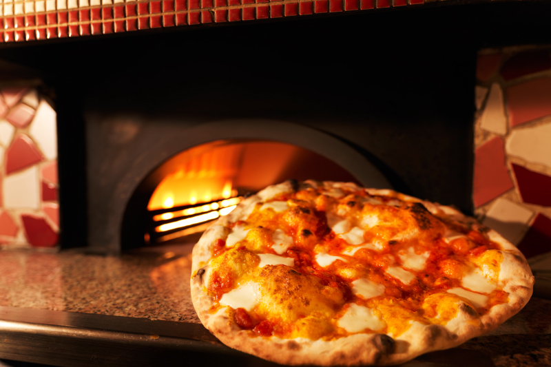 Traditional Italian style pizza baked in an authentic pizza oven