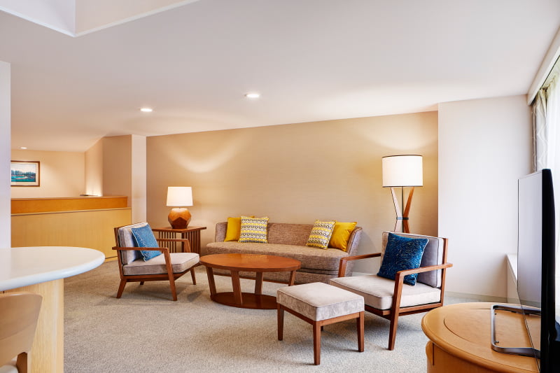 Living room with a high ceiling and large window