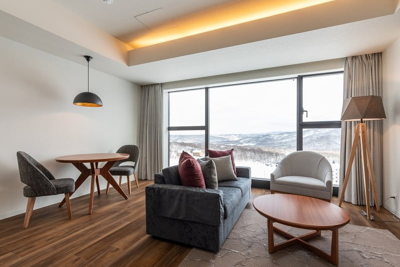 Spacious living room with large windows creates a sense of openness 