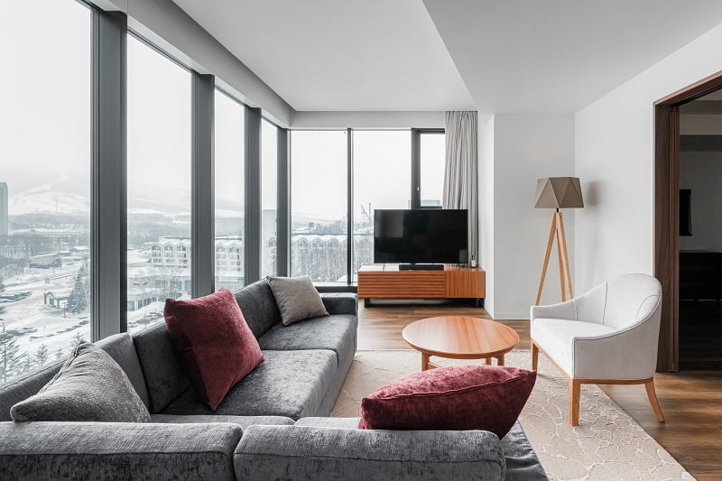 Spacious living room with large windows creates a sense of openness 