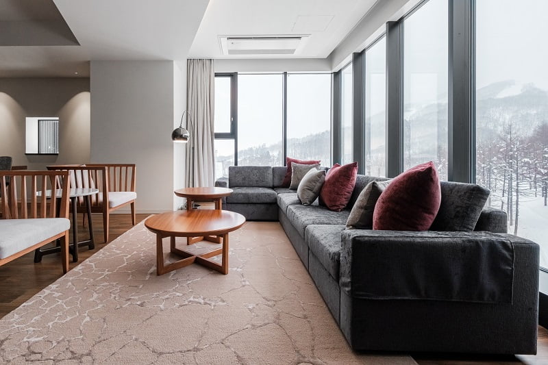 Spacious living room with large windows creates a sense of openness 