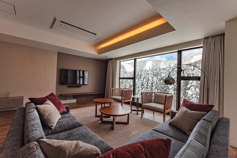 Spacious living room with large windows creates a sense of openness 